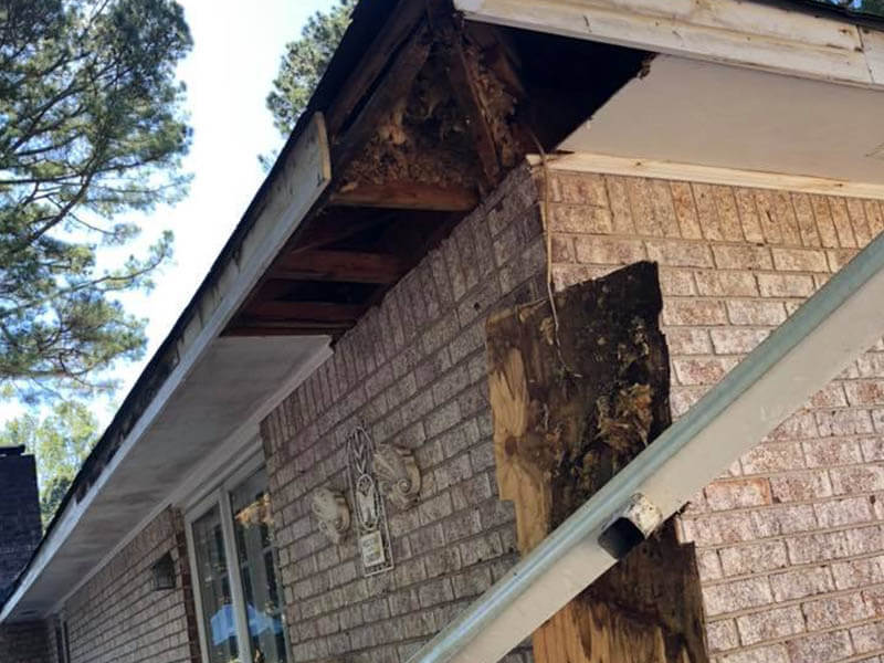 Professional gutter installation in progress on Atlanta home exterior